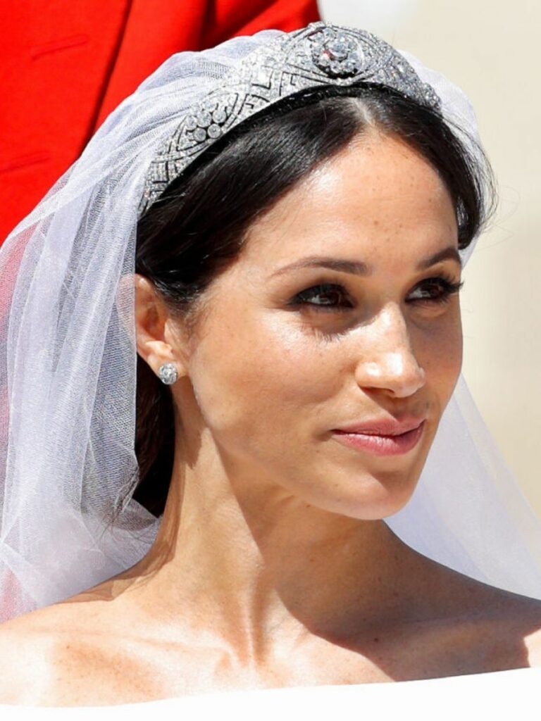 Close up of bride wearing a diamond-encrusted tiara with veil